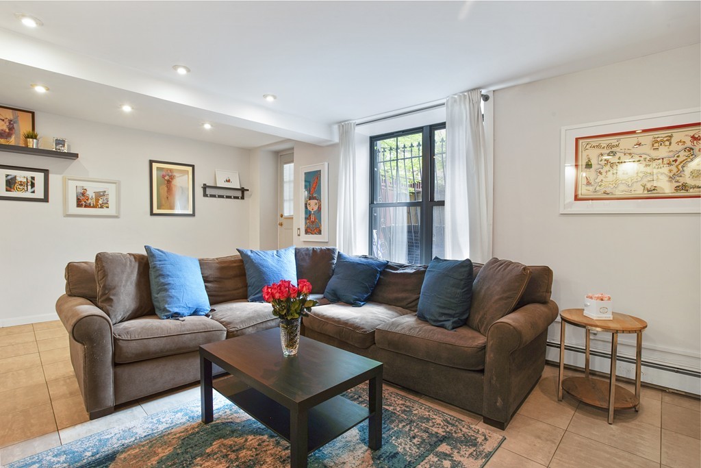 1670 Washington Street, Unit 6 Boston, MA 02118 - Photo 5 of 17 a living room with furniture and a window