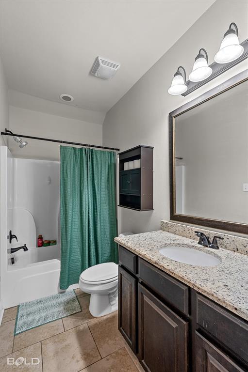 946 Maize Street Bossier City, LA 71111 - Photo 35 of 39 a bathroom with a granite countertop sink toilet and shower