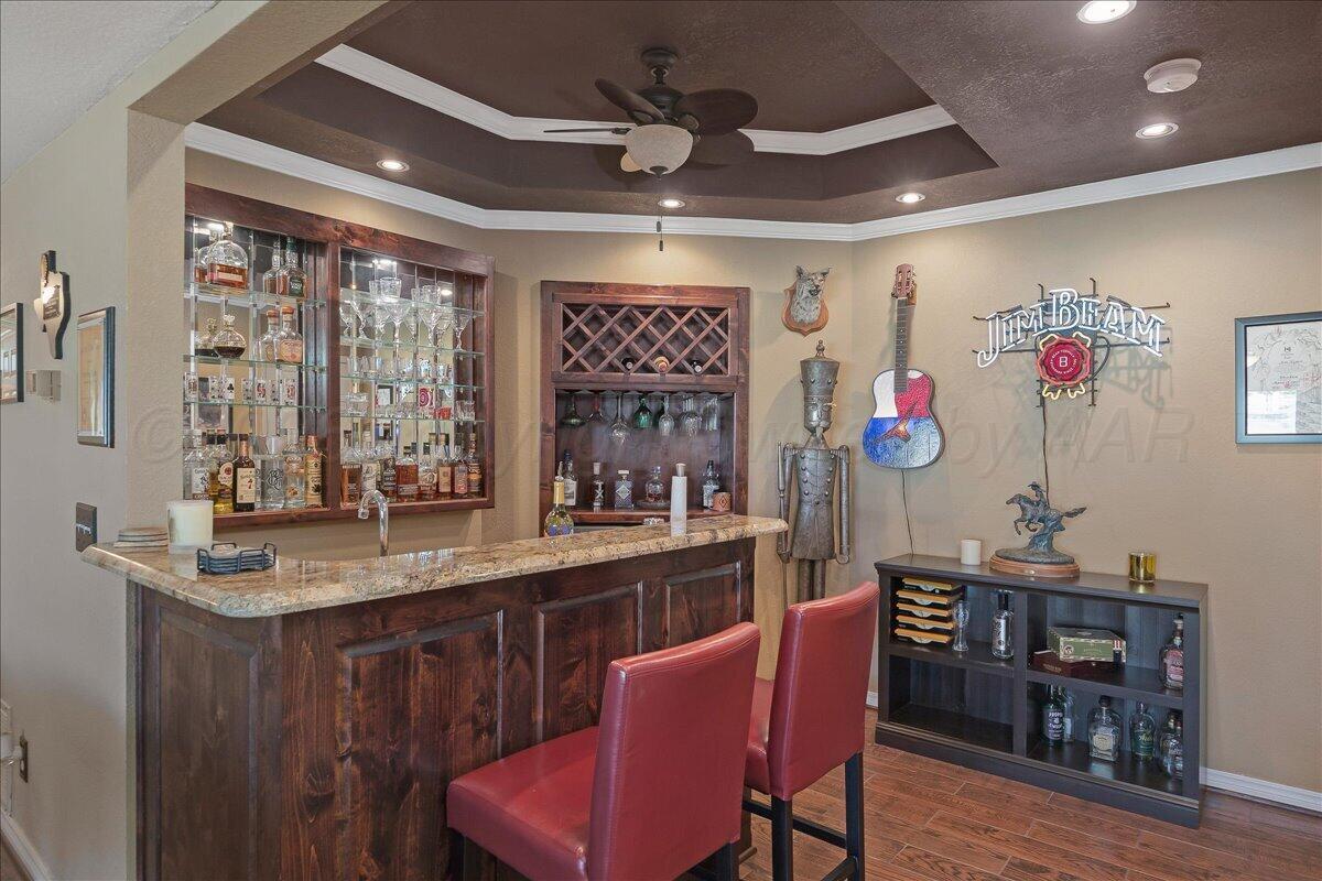 5 Locke Place Amarillo, TX 79124 - Photo 27 of 53 a kitchen with a dining table chairs cabinets and stainless steel appliances