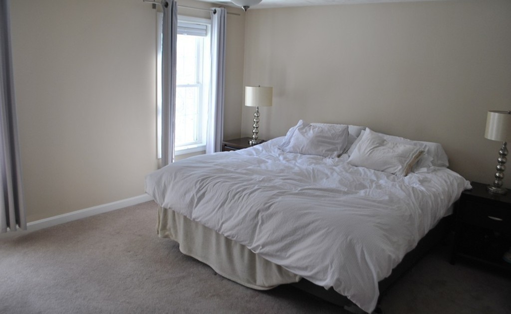 8 Honeysuckle Road Worcester, MA 01607 - Photo 17 of 27 a bed sitting in a bedroom next to a window
