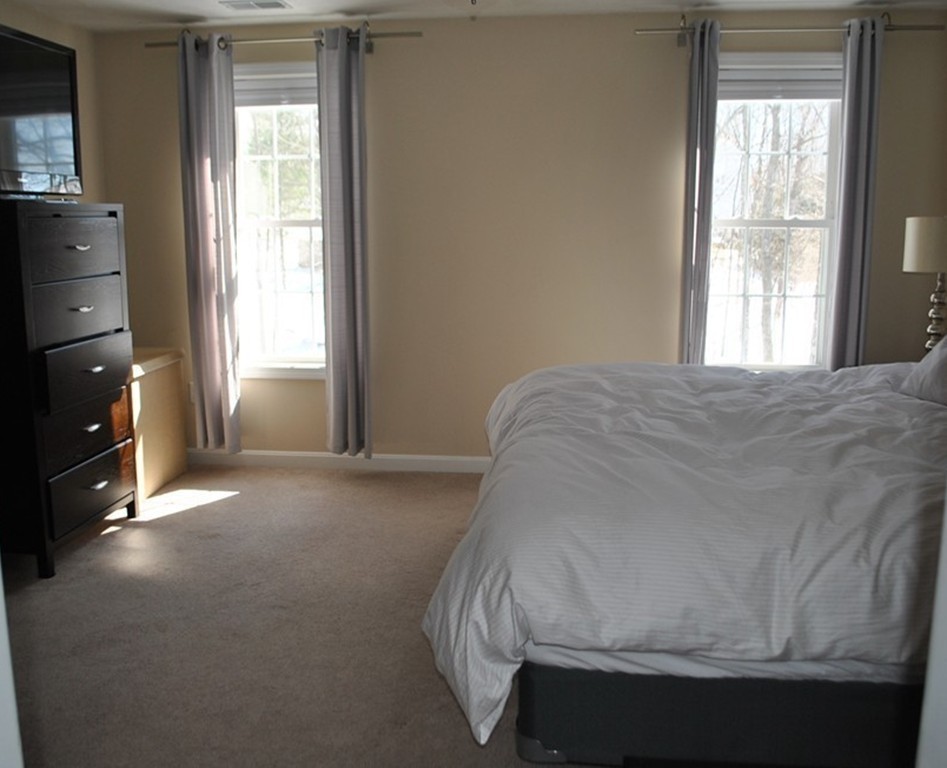 8 Honeysuckle Road Worcester, MA 01607 - Photo 19 of 27 a bed sitting in a bedroom next to a window