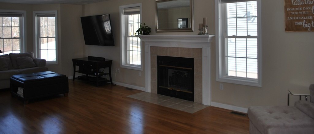 8 Honeysuckle Road Worcester, MA 01607 - Photo 5 of 27 a living room with furniture and a fireplace