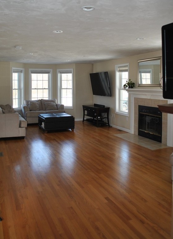 8 Honeysuckle Road Worcester, MA 01607 - Photo 7 of 27 a living room with furniture fireplace and flat screen tv