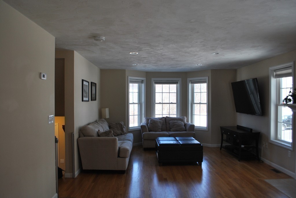 8 Honeysuckle Road Worcester, MA 01607 - Photo 8 of 27 a living room with furniture window and wooden floor
