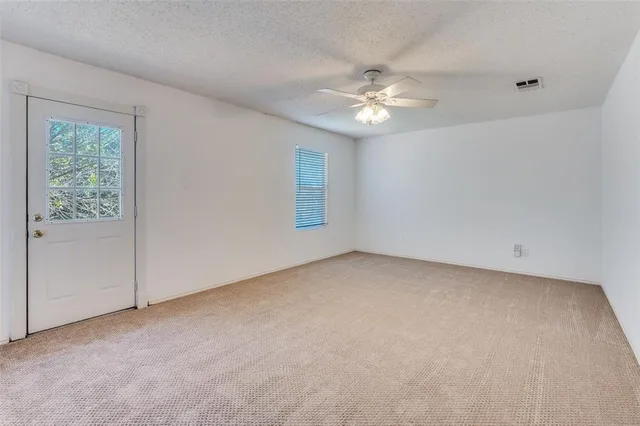 a kitchen with cabinets and white appliances