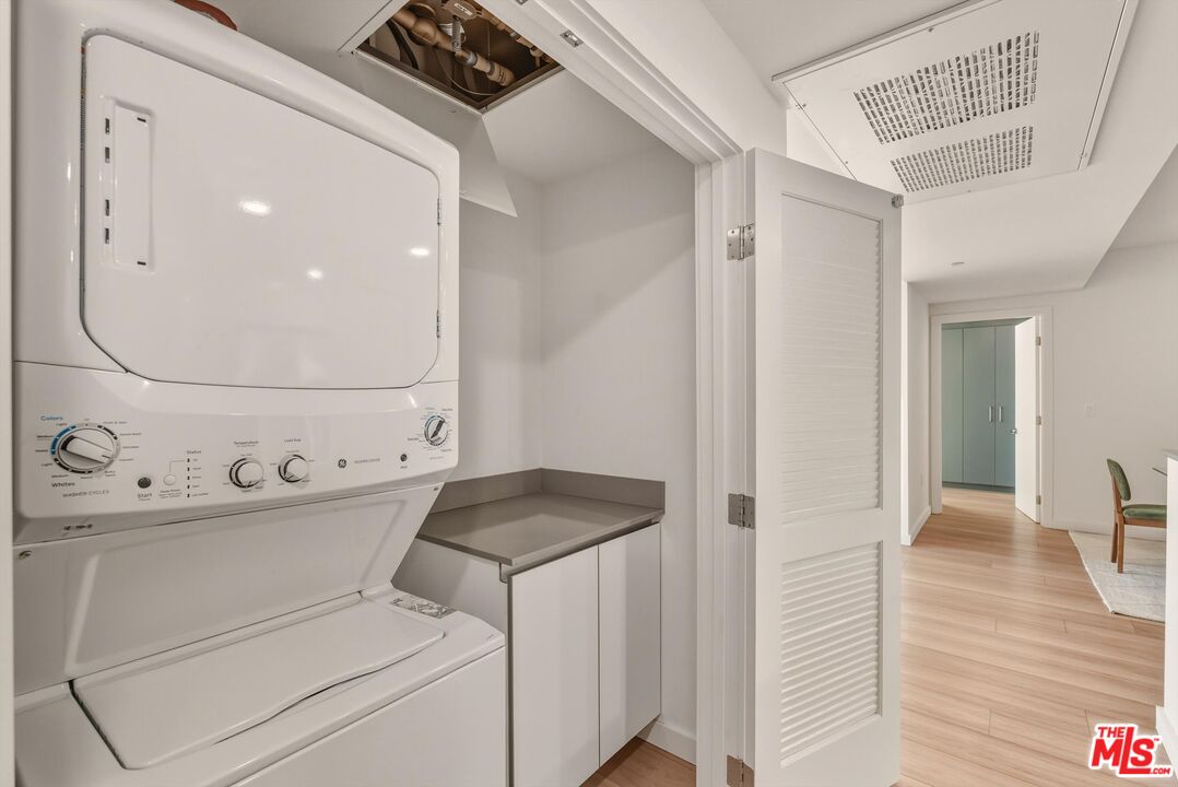 1759 North Gower Street, Unit 404 Los Angeles, CA 90028 - Photo 13 of 23 a utility room with dryer and washer