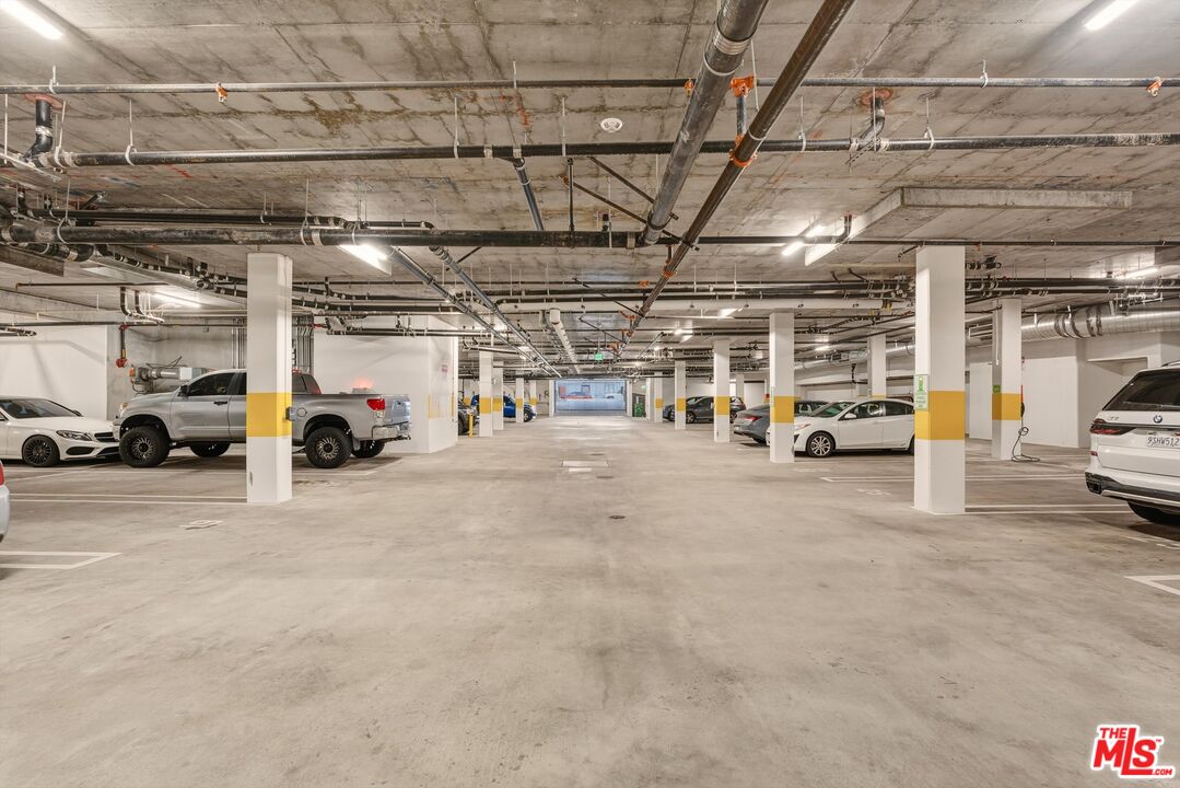 1759 North Gower Street, Unit 404 Los Angeles, CA 90028 - Photo 22 of 23 a view of parking garage with cars