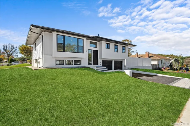 a front view of house with yard and green space