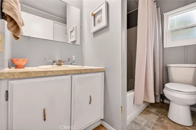 a bathroom with a sink toilet and vanity