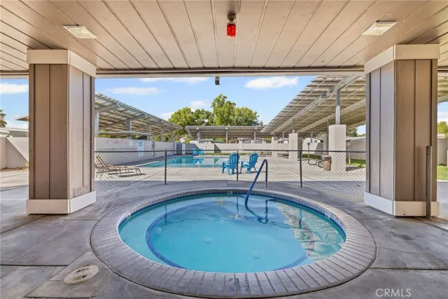 a view of a backyard with sitting area