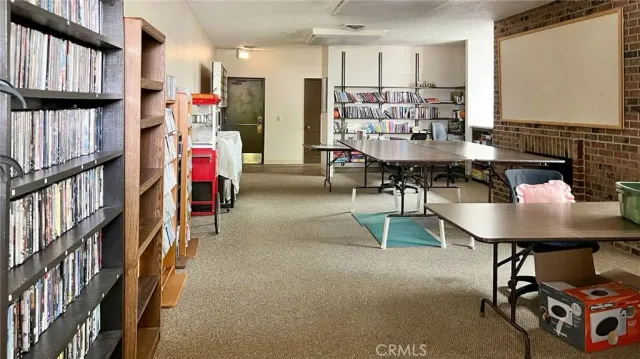 an aerial view of a house with a yard and a fountain