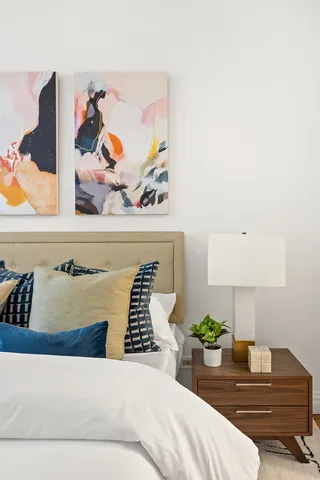 a bedroom with a bed and a table