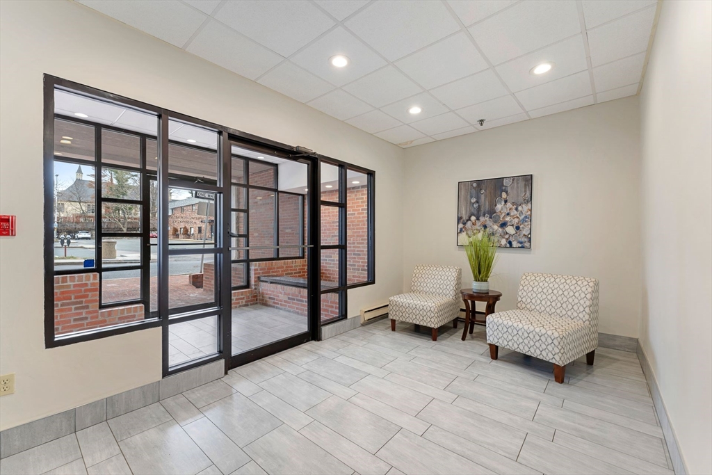 31 Spring Street, Unit 308 Watertown, MA 02472 - Photo 14 of 37 a living room with furniture