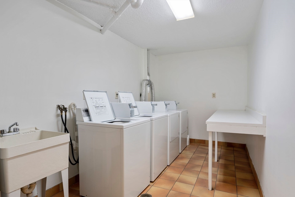 31 Spring Street, Unit 308 Watertown, MA 02472 - Photo 15 of 37 a utility room with dryer and washer