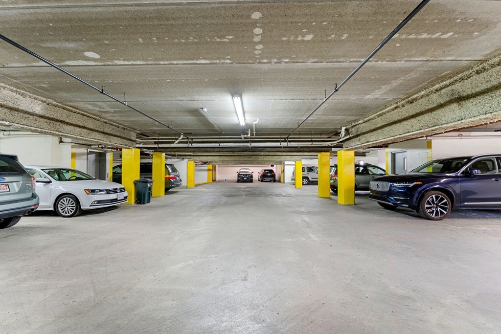 31 Spring Street, Unit 308 Watertown, MA 02472 - Photo 21 of 37 a view of parking garage with cars