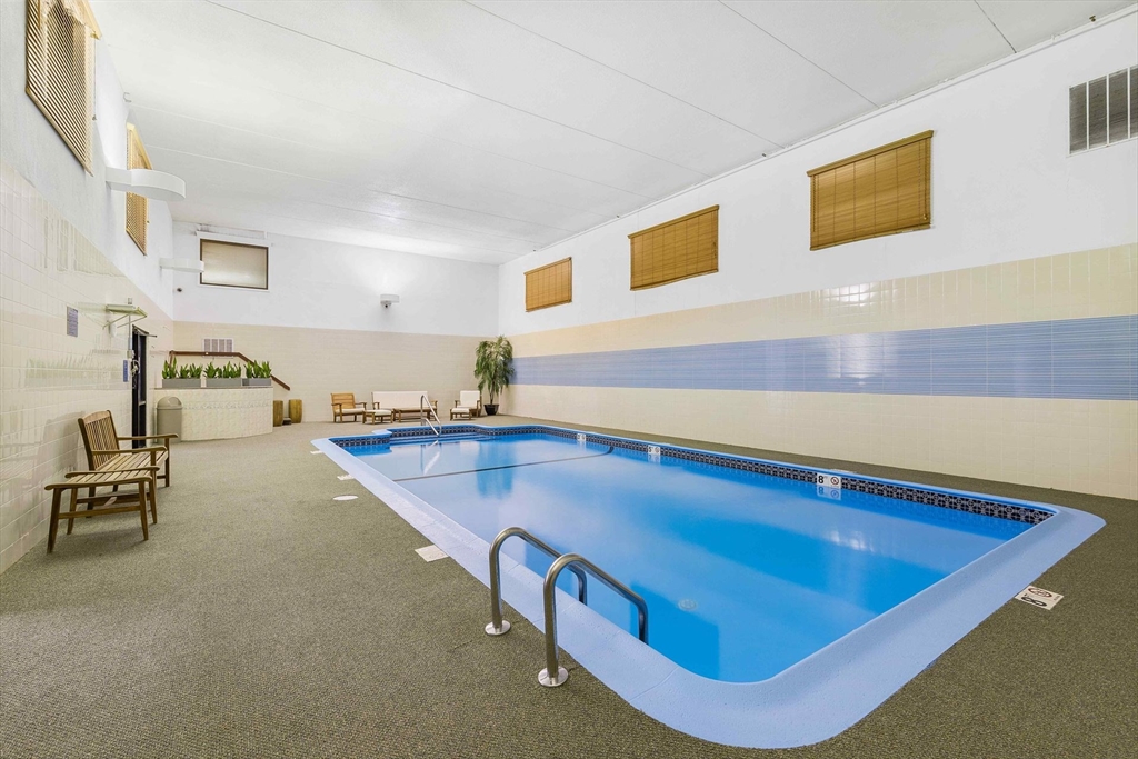 31 Spring Street, Unit 308 Watertown, MA 02472 - Photo 26 of 37 a room with pool table and chairs