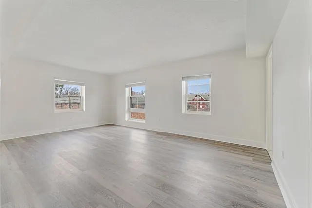 a bathroom with a sink toilet vanity and shower