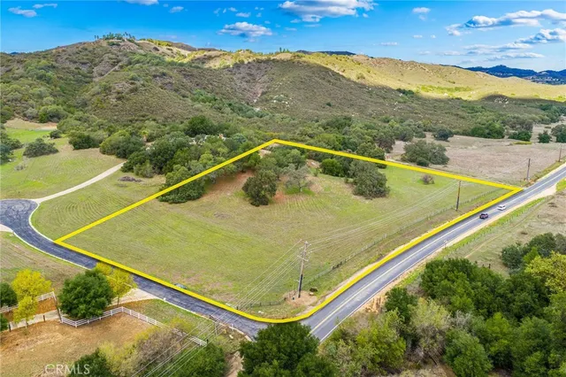 a view of a tennis court with a mountain in the background