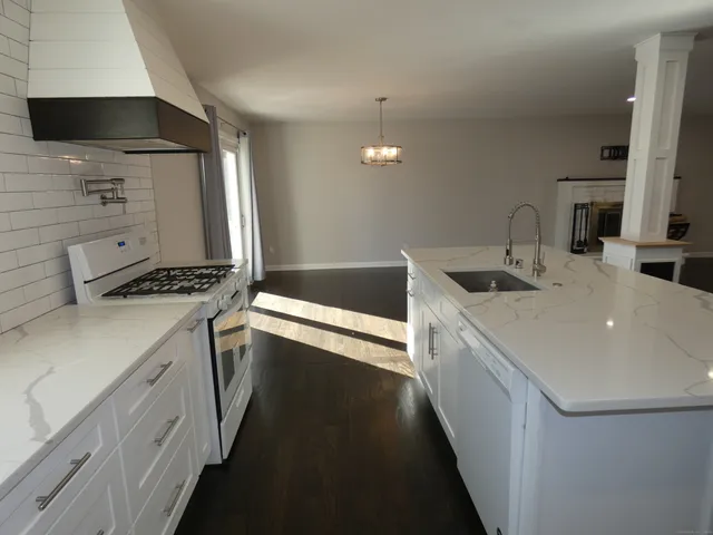 a kitchen that has a sink and a stove