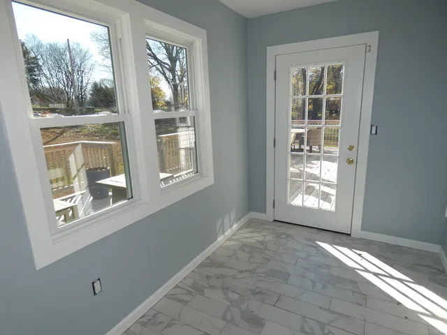 a view of empty room with windows