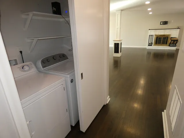 a view of storage and utility room with washer and dryer