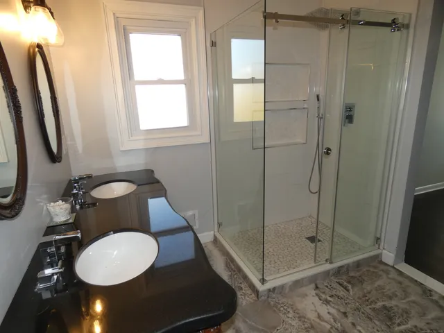 a bathroom with a sink toilet and shower