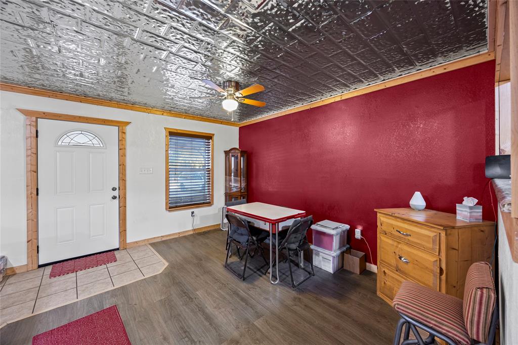 153 Center Loop Whitney, TX 76692 - Photo 5 of 10 a balcony with chairs and wooden floor