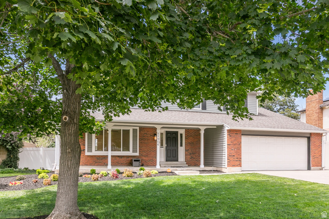 11906 Woodridge Road Sandy, UT 84094 - Photo 3 of 35 Mature shade tree in front yard provides the perfect setting for sitting on the porch and taking in the view of the Wasatch Mountains