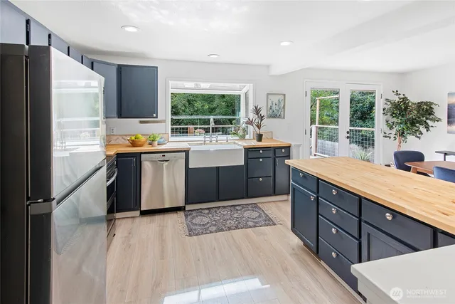 a kitchen with lots of counter top space and appliances