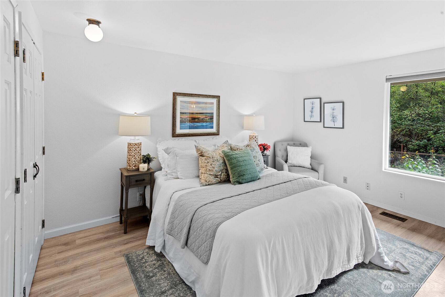 10211 Northeast Roberts Road Bainbridge Island, WA 98110 - Photo 16 of 39 a bedroom with a bed and a window
