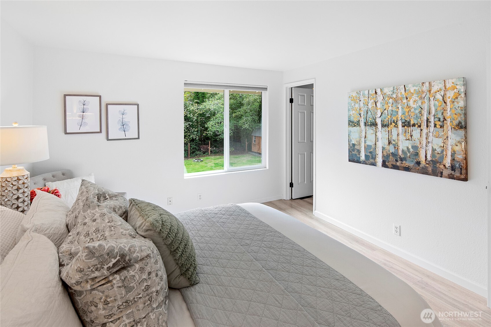 10211 Northeast Roberts Road Bainbridge Island, WA 98110 - Photo 17 of 39 a bedroom with a bed and a window