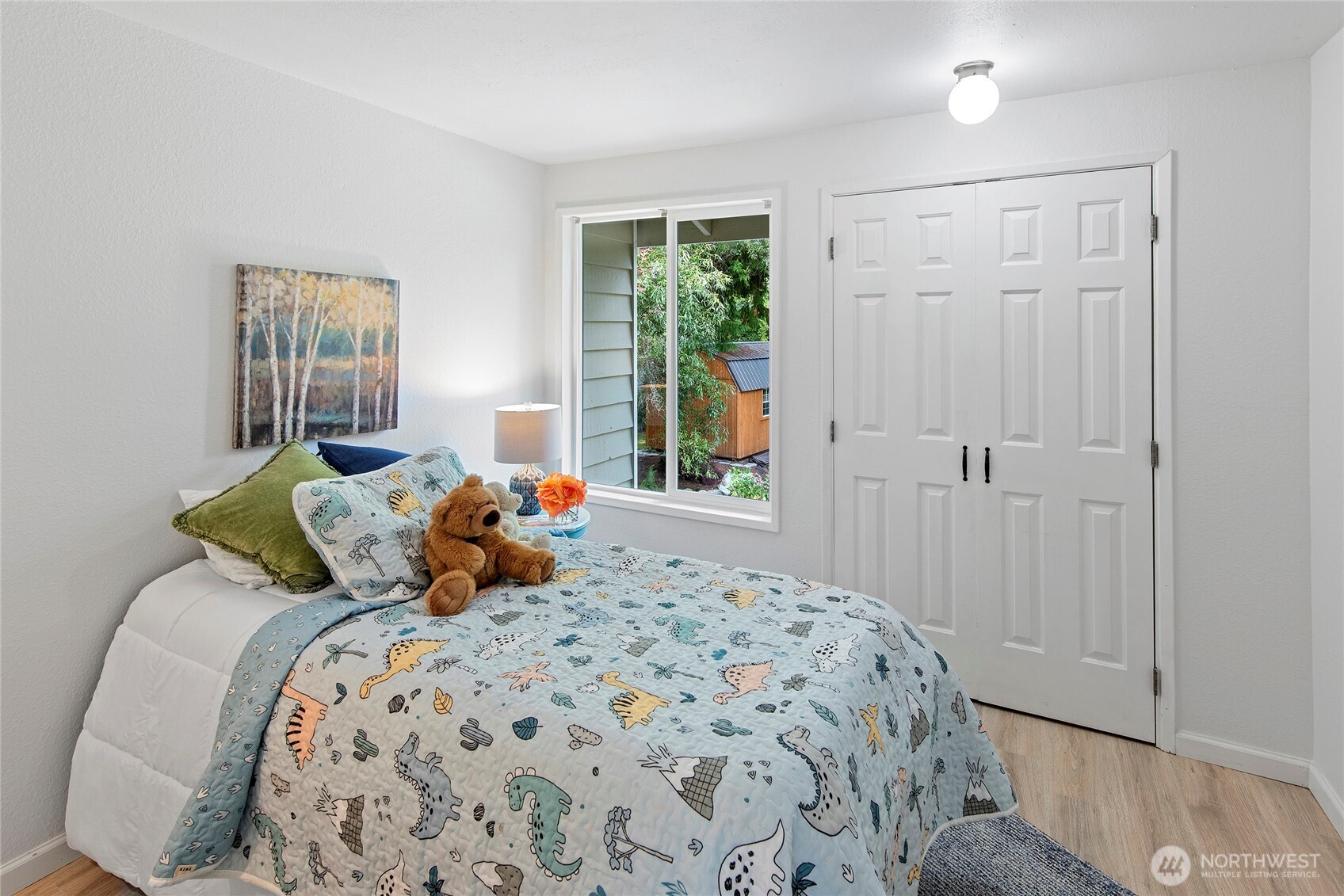 10211 Northeast Roberts Road Bainbridge Island, WA 98110 - Photo 22 of 39 a bedroom with a bed and window