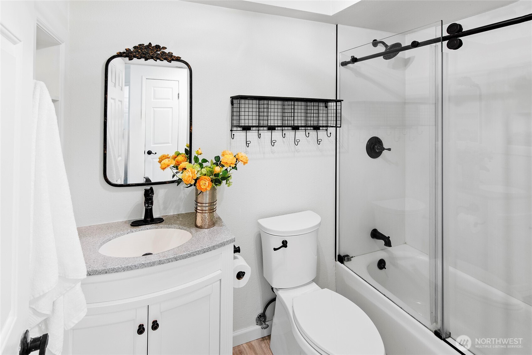 10211 Northeast Roberts Road Bainbridge Island, WA 98110 - Photo 23 of 39 a bathroom with a sink toilet and shower