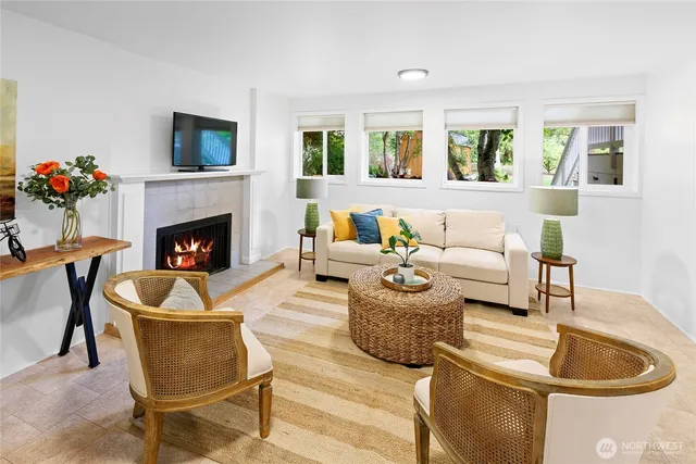 a living room with furniture and a fireplace