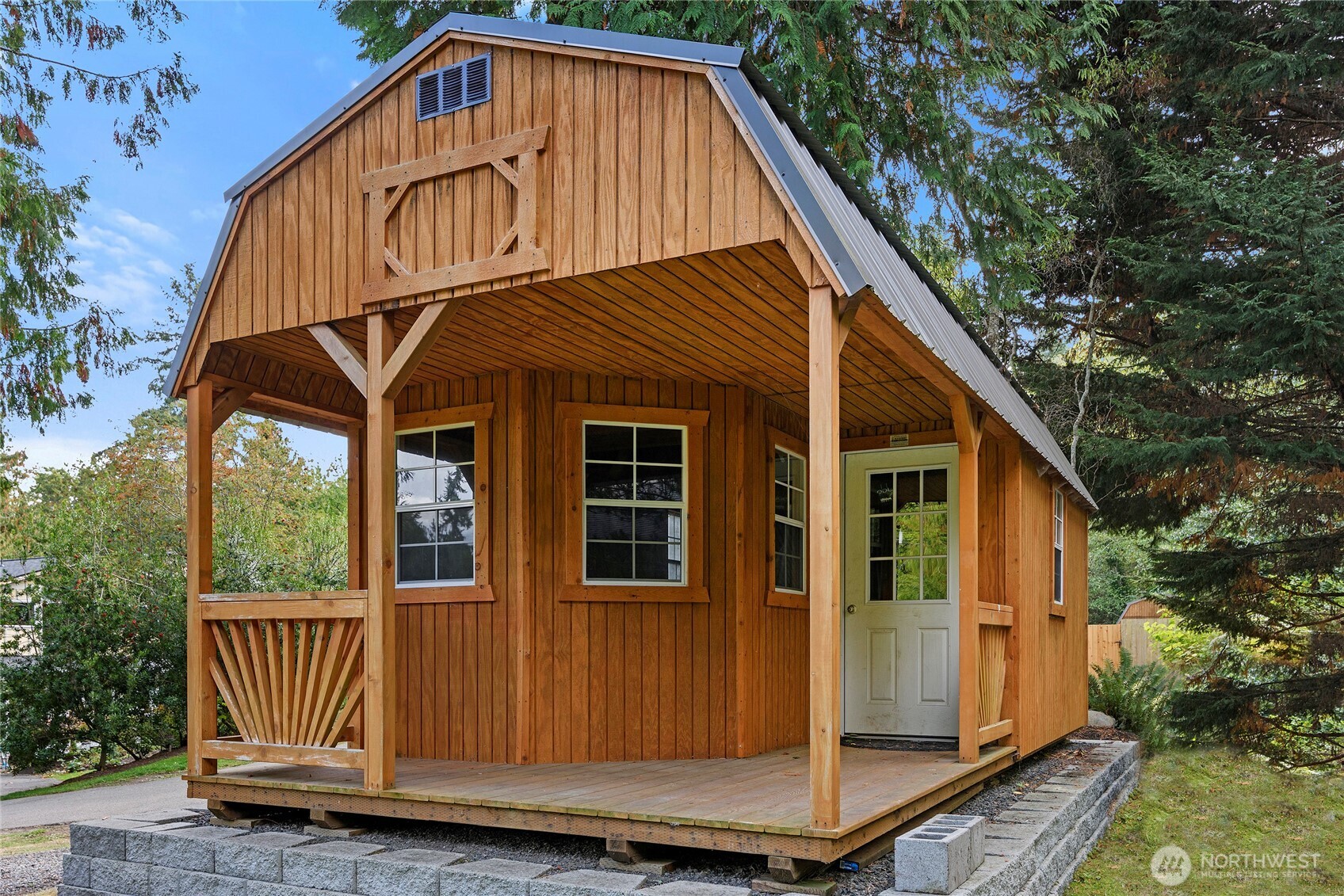 10211 Northeast Roberts Road Bainbridge Island, WA 98110 - Photo 30 of 39 a view of a house with wooden fence