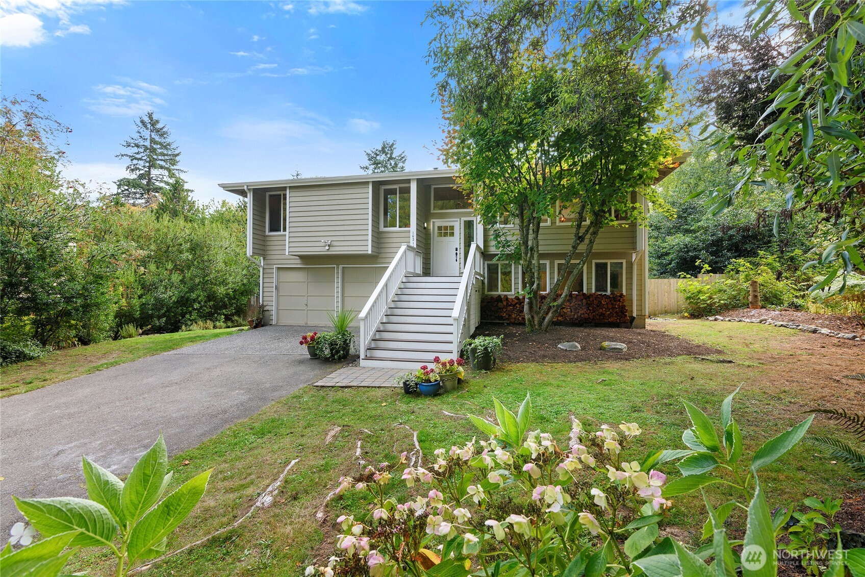 10211 Northeast Roberts Road Bainbridge Island, WA 98110 - Photo 5 of 39 a view of a house with a yard