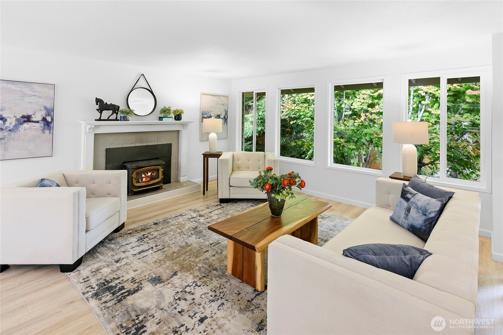 10211 Northeast Roberts Road Bainbridge Island, WA 98110 - Photo 7 of 39 a living room with furniture and a fireplace