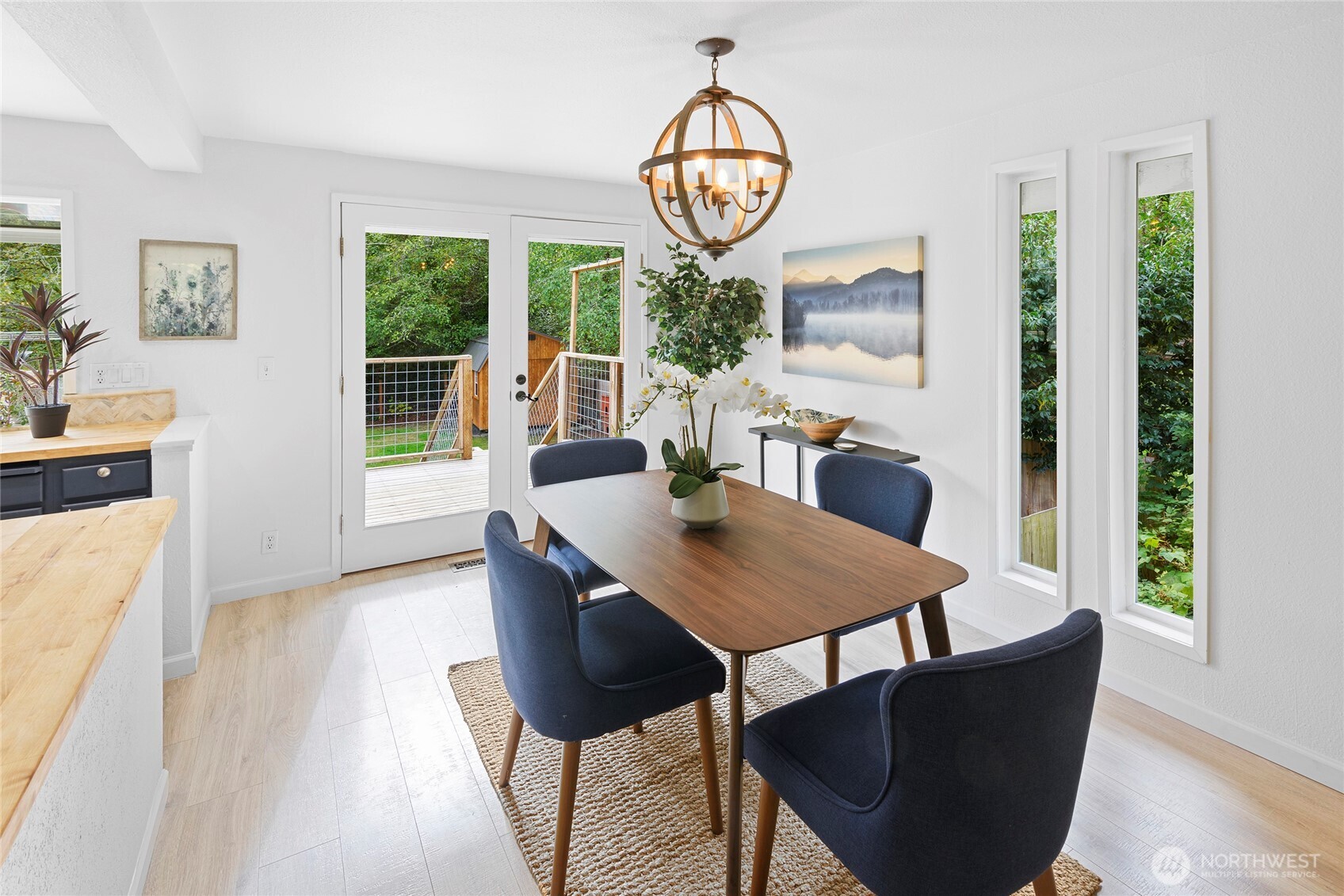 10211 Northeast Roberts Road Bainbridge Island, WA 98110 - Photo 10 of 39 a view of a dining room with furniture window and outside view