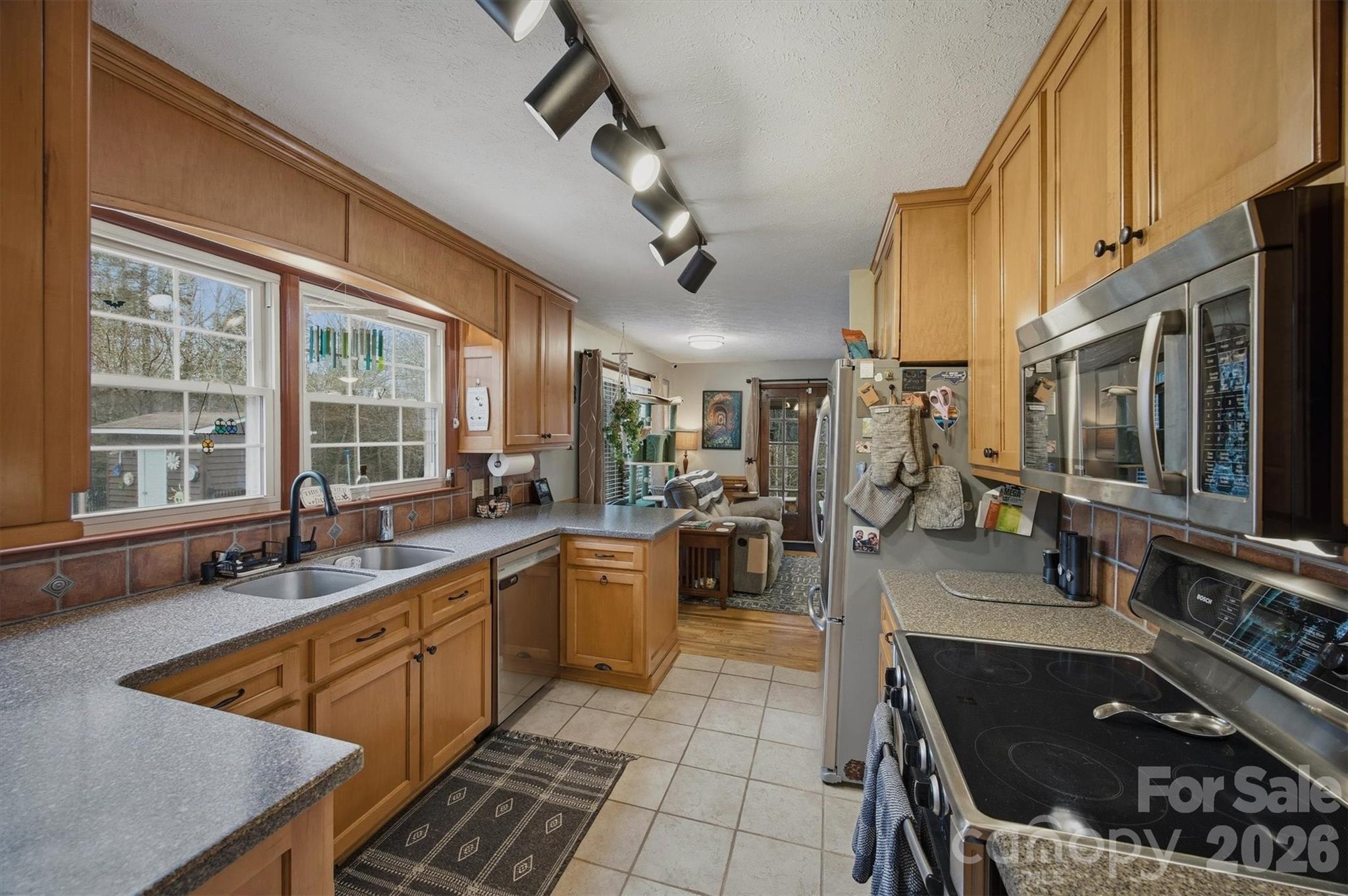 4157 Beck Road Morganton, NC 28655 - Photo 11 of 35 a kitchen with stainless steel appliances granite countertop a sink and a stove