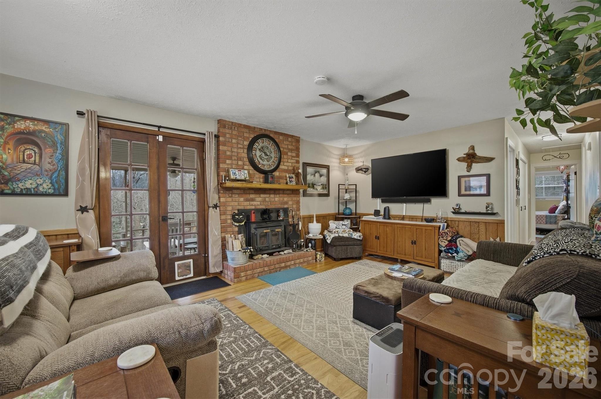 4157 Beck Road Morganton, NC 28655 - Photo 13 of 35 a living room with furniture a flat screen tv and a fireplace