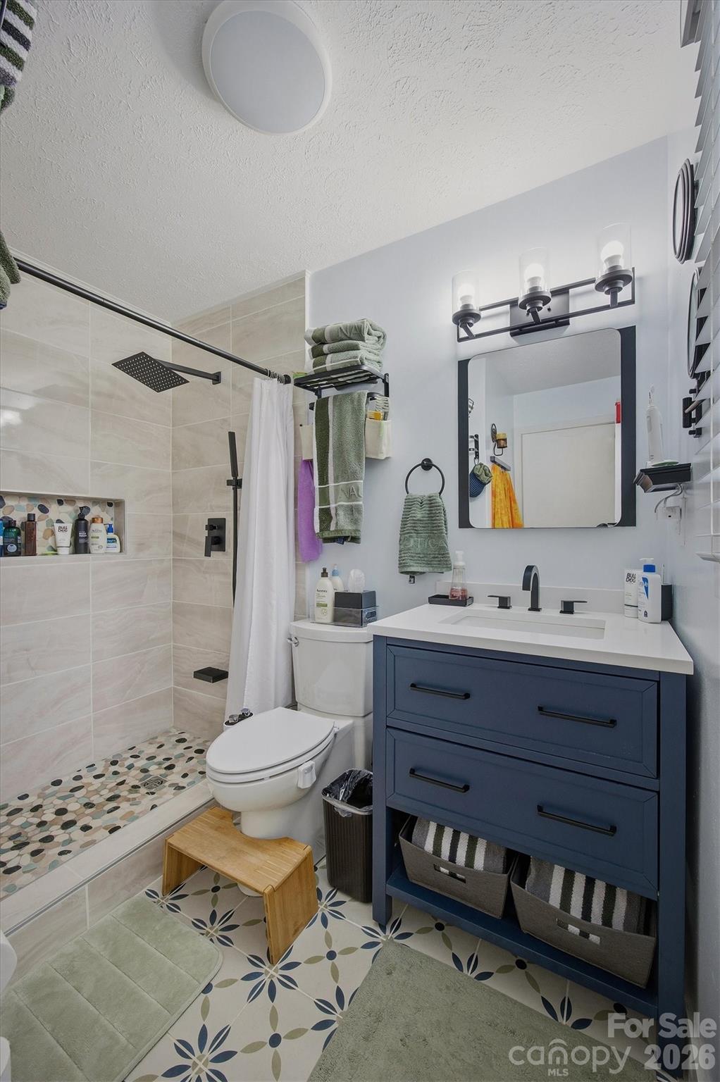 4157 Beck Road Morganton, NC 28655 - Photo 19 of 35 a bathroom with a sink toilet and shower