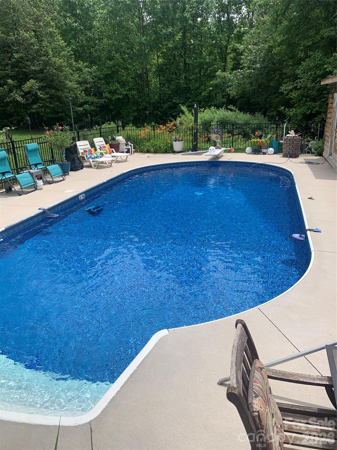 4157 Beck Road Morganton, NC 28655 - Photo 25 of 35 a view of a swimming pool with a patio