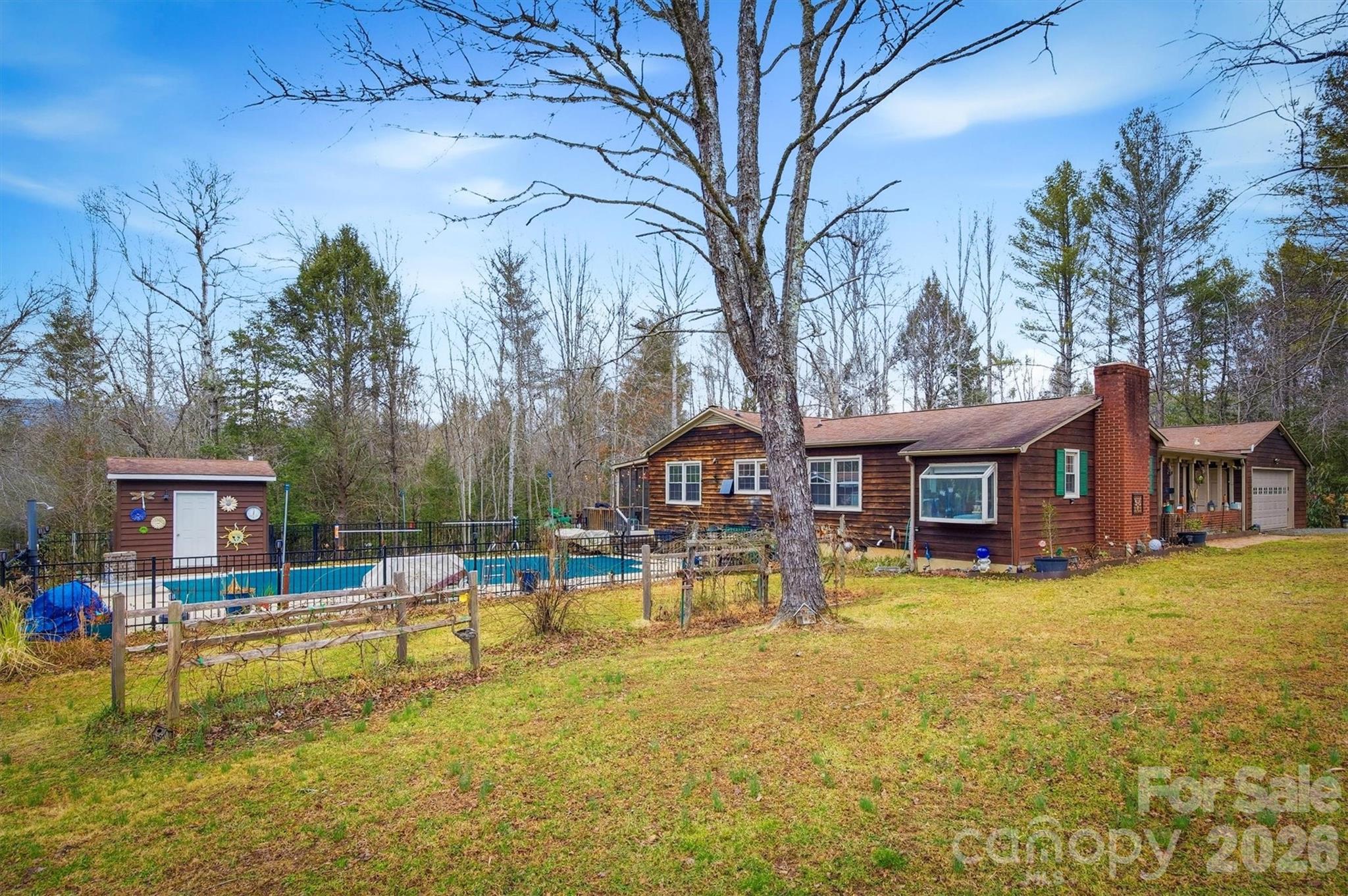 4157 Beck Road Morganton, NC 28655 - Photo 28 of 35 a view of a house with a swimming pool and sitting area