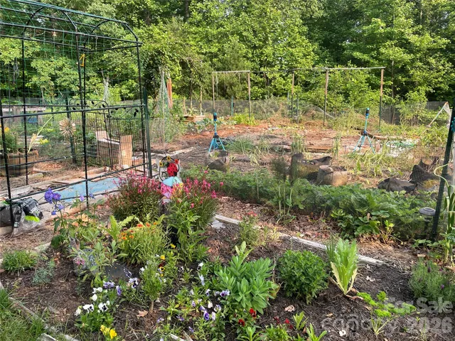 a view of a house with a yard patio and slide