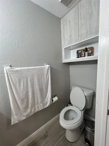 a bathroom with a toilet and a sink