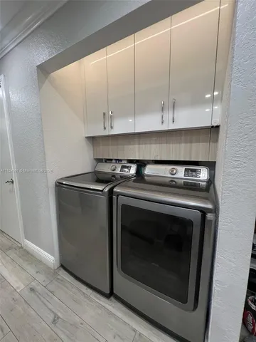 a stove top oven sitting inside of a kitchen