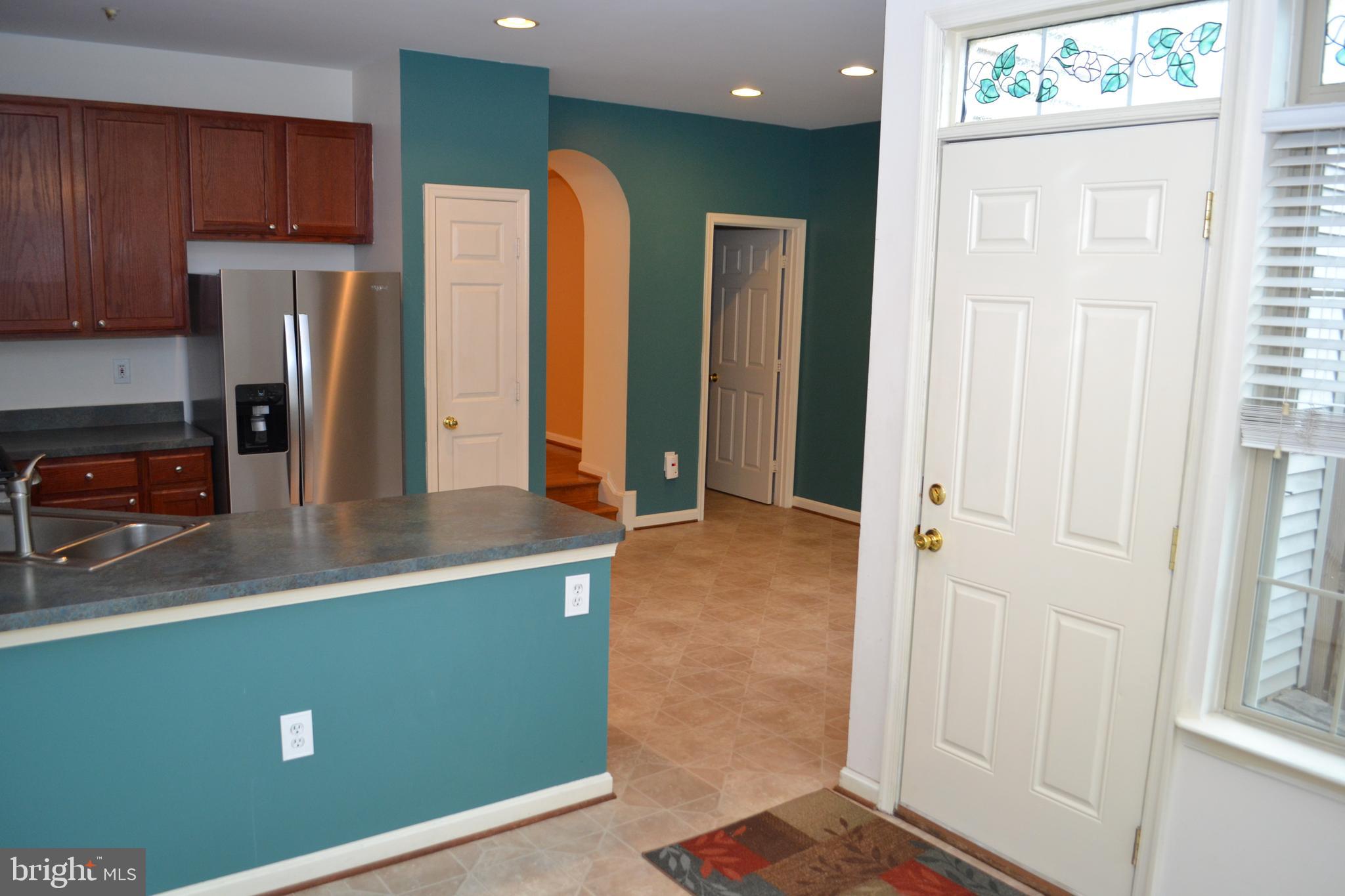 2202 Garden Lane Frederick, MD 21701 - Photo 14 of 50 a kitchen with stainless steel appliances a refrigerator and a stove