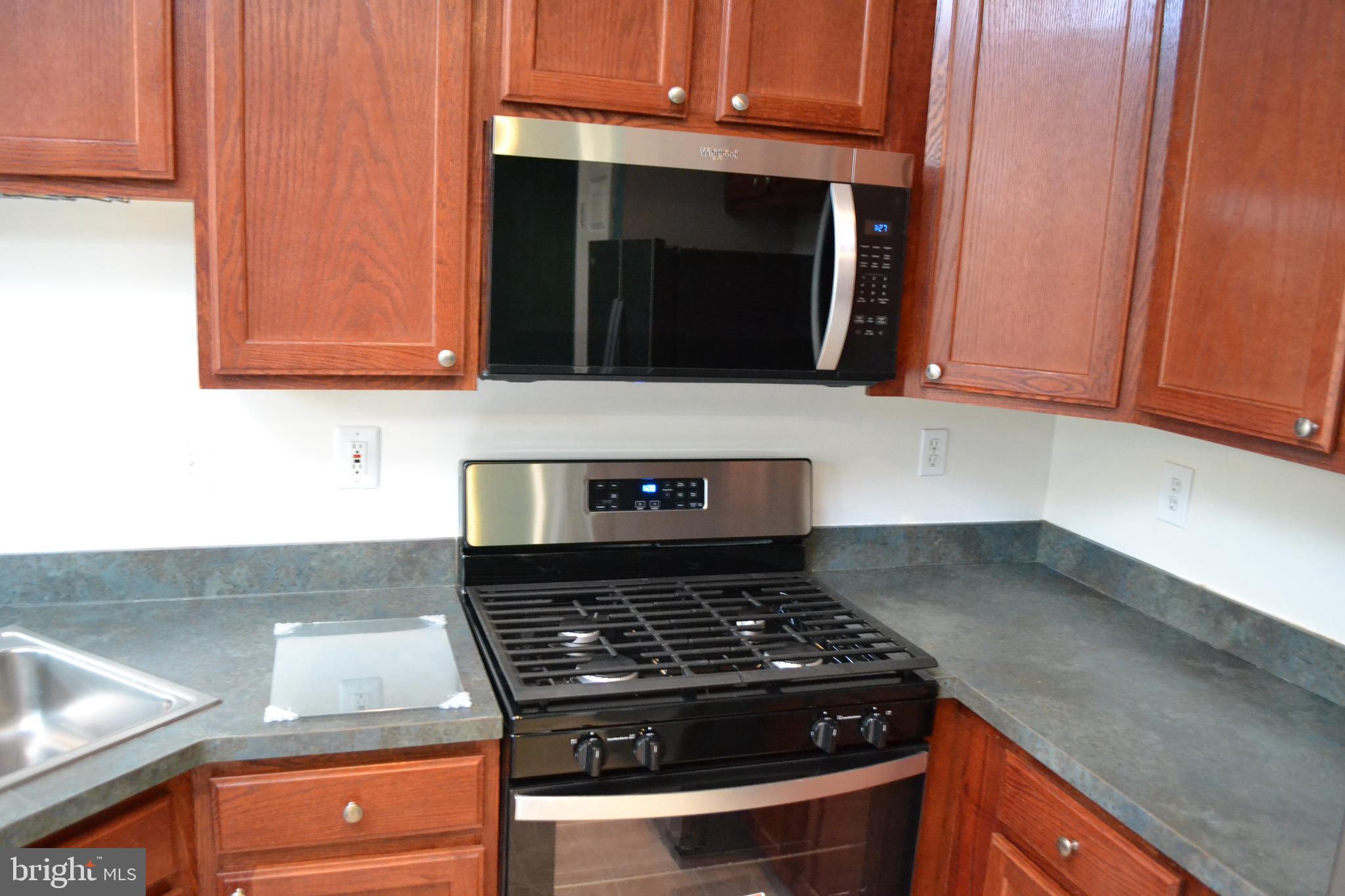 2202 Garden Lane Frederick, MD 21701 - Photo 16 of 50 a stove top oven sitting inside of a kitchen