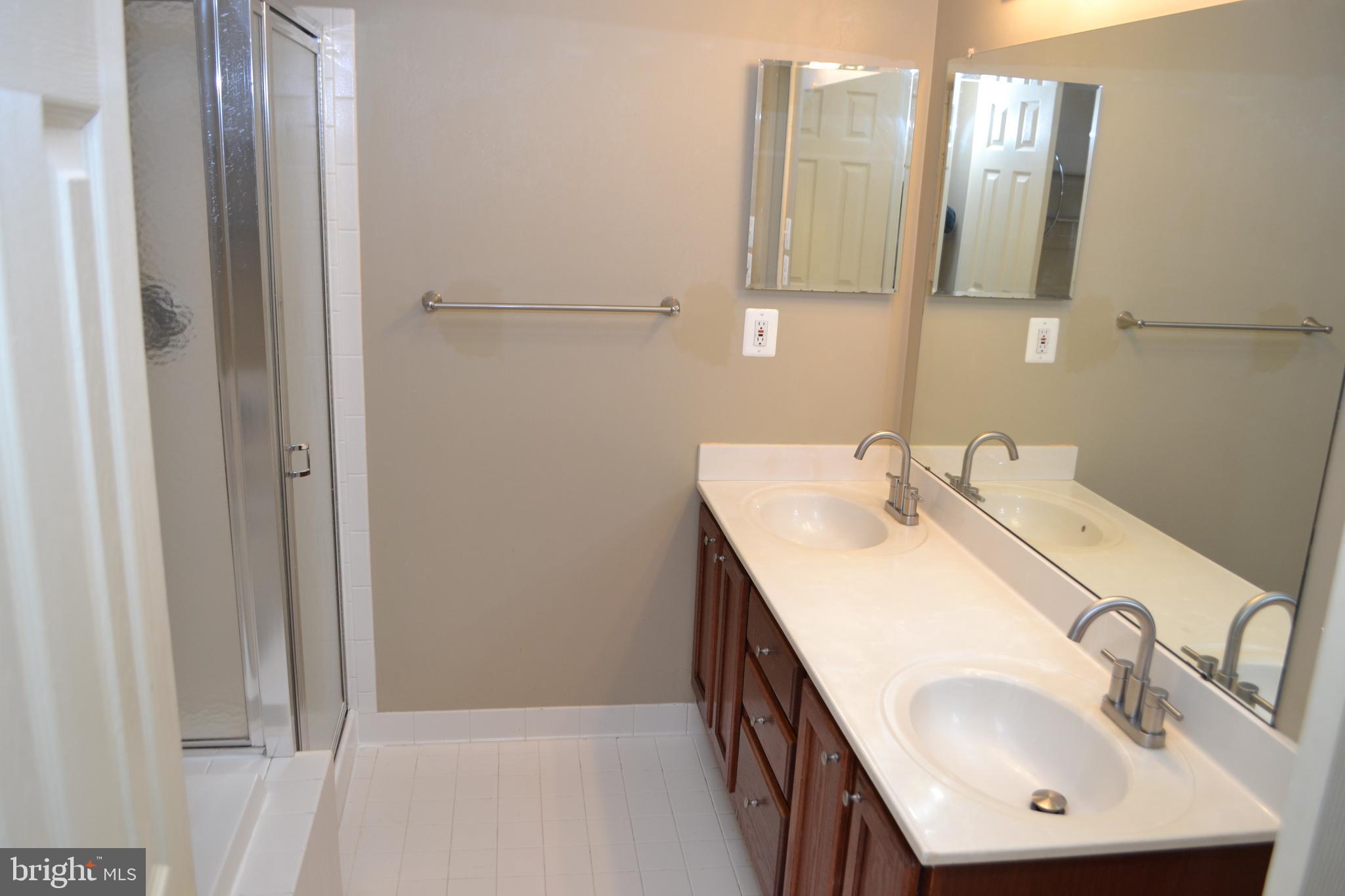2202 Garden Lane Frederick, MD 21701 - Photo 29 of 50 a bathroom with a sink and a mirror