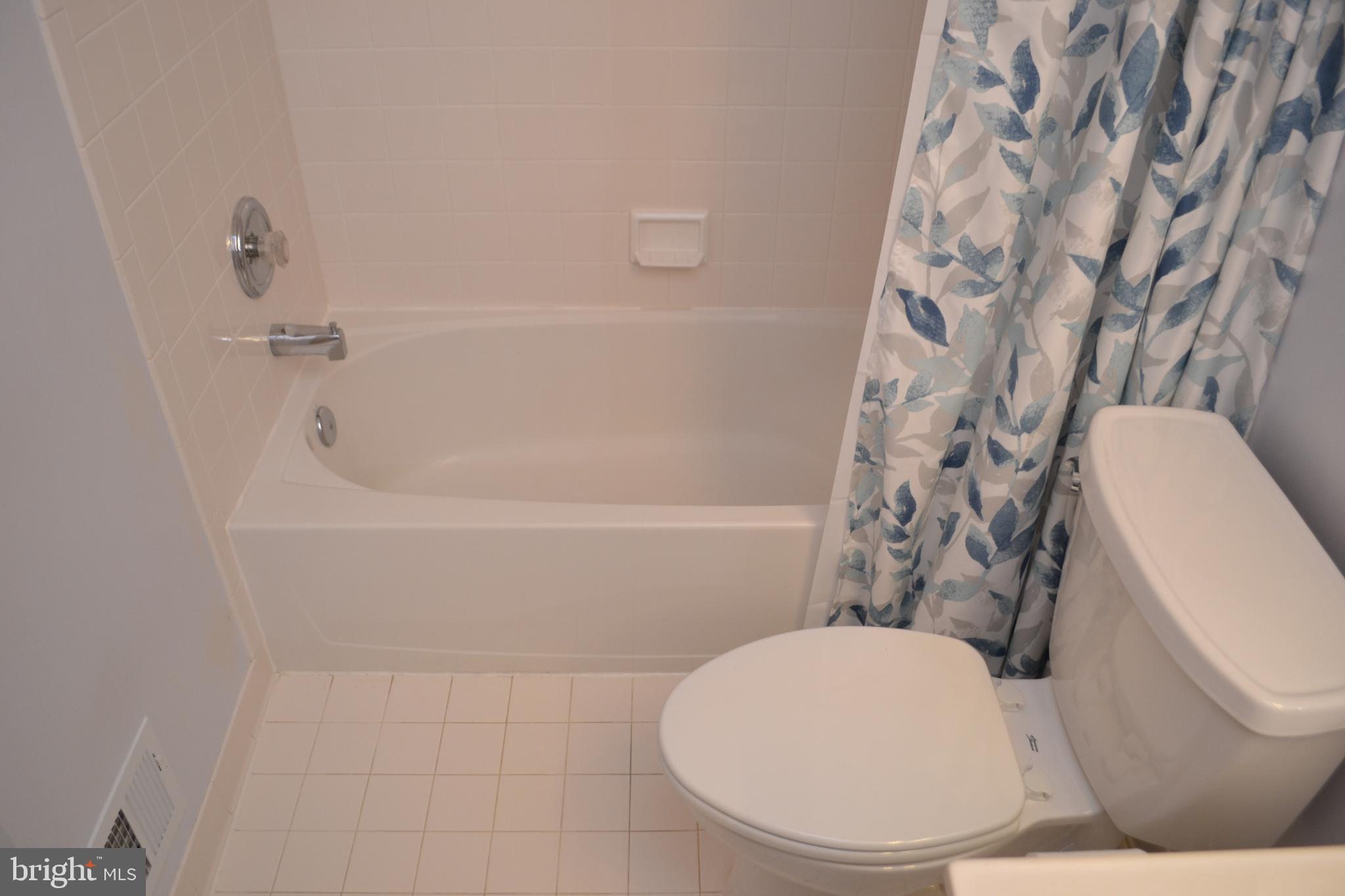 2202 Garden Lane Frederick, MD 21701 - Photo 39 of 50 a white toilet sitting next to a bath tub